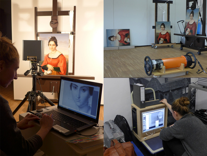 Gemälderestaurierung Zwei Personen an Laptops bearbeiten ein Gemälde, das im Hintergrund zu sehen ist.